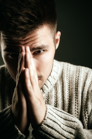 man. Beard and facial care. male grooming and barber. Fashion portrait of man. facial emotions. fashion man with unshaven beard. wish and hope. serious man pary with hand gesture.の写真素材