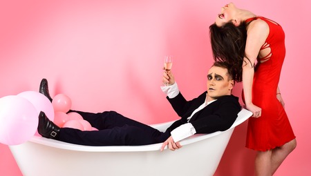 Expressing their feelings or emotions. Mime artists. Couple in love mime enjoy in bath room. Couple...