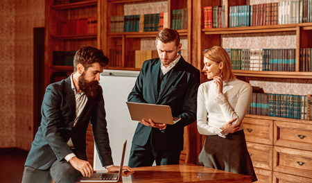 Blogging concept. Woman and man started blogging in library. Business people use video blogging and...