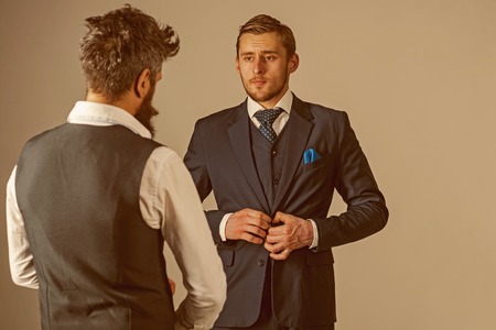Looking their best. Men wear business formal fashion style. Fashion models in business relations. Friends in friendship relations. Bonds of friendship and cooperation among businessmenの写真素材