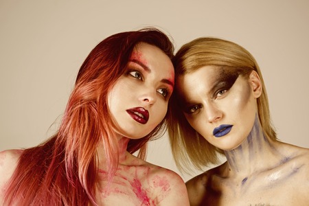 Beauty concept. Sensual women with beauty look. Women with makeup and body art beauty. The most colorful name in beauty.の写真素材