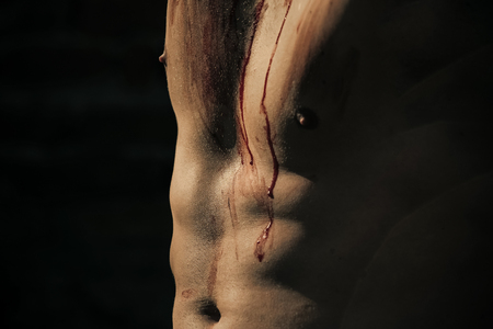 halloween muscular chest of man zombie with bloodの写真素材