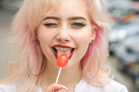 girl with fashion makeup. Hair loss and care. Beauty salon and hairdresser. Makeup cosmetics and skincare. Fashion portrait of woman. hair coloring. Loving her new style. happy beautiful girl.の写真素材