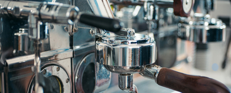 Espresso machine parts. Commercial coffee machine. Coffee maker in coffee shop. Stainless steel cooking appliance to brew coffee. Espresso being brewed in cafe. All your favourite coffees.の写真素材