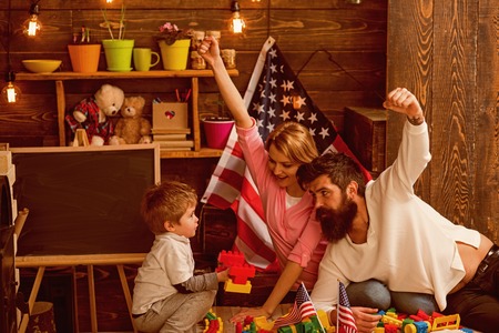 Family reunion. Family reunion for independence day. Family reunion with american flags in preschool. National holiday celebration with family reunion. United we standの写真素材