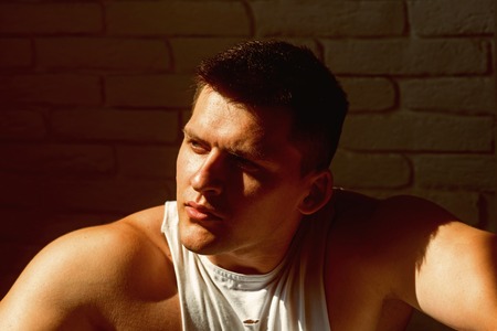 Man with young face. Macho with short hair or haircut. Handsome guy with healthy skin. Youth skincare and grooming conceptの写真素材