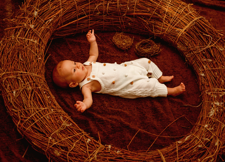 Newborn baby girl or boy. Newborn baby awake in crib. Newborn care routine. Early development. Child development and growth stages. Kids grow up quickly, dont they. Care that never quitsの写真素材