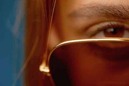 Choosing trendy glasses perfect for her style. Cute woman with fashion accessory. Pretty woman wear eye glasses. Fashion model in trendy sun glasses. Cute and stylishの写真素材