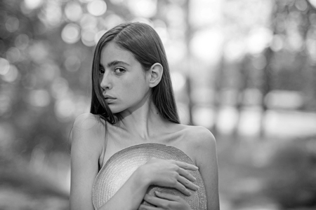 Topless girl with hat before chest, fashionの写真素材