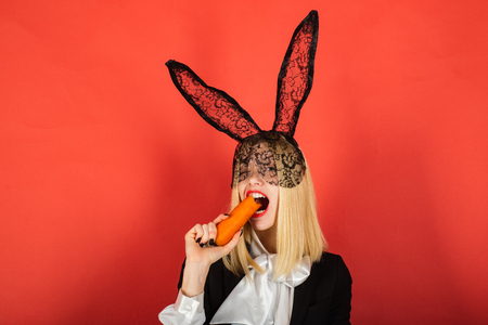 Happy young woman wearing bunny ears and having Easter Eggs. Smile easter.の写真素材