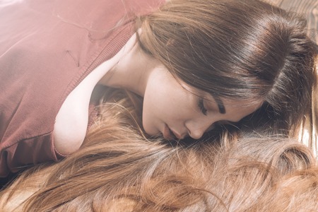 Trendy haircuts. Beauty hair Salon. Woman with beautiful long hair on wooden background. Long hair. Fashion haircut.の写真素材