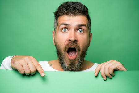 Green patricks background. Man in Saint Patricks Day leprechaun party hat having fun on green background.の写真素材