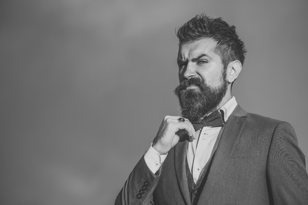 Man with beard and mustache with dramatic sky on background.の写真素材