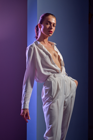 Amazing woman. Beautiful young elegant model with red lips. Sexy woman in white.の写真素材