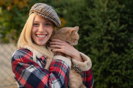 Adorable blonde fashion girl. Enjoy fall season. Autumn is here. Fashion trend. Pretty woman in hat. Fancy girl. Woman wear checkered clothes nature background. Girl wear kepi. Fall fashion accessoryの写真素材