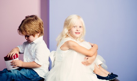 Friendship and love. Lovely tender children. Small kids friendship. Sincere friendship. Couple adorable kids white clothes. Happy childhoodの写真素材