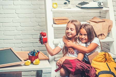 perfect morning with two lovely kids. perfect morning of little girls ready to go to schoolの写真素材