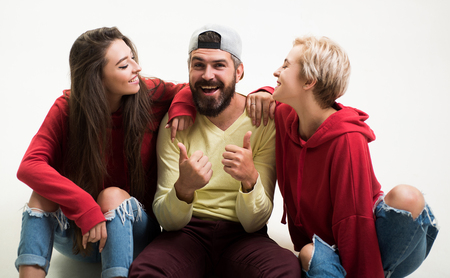 Forever young. Group hang out together. Carefree people. Youth just want to have fun. Freedom feeling. Youth fashion. Feeling free and stylish. Man and women wear modern clothes for youth generationの写真素材