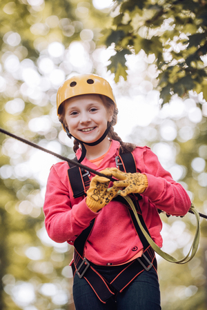 Child playing on the playground. Go Ape Adventure. Child boy having fun at adventure park. Early childhood development.の写真素材