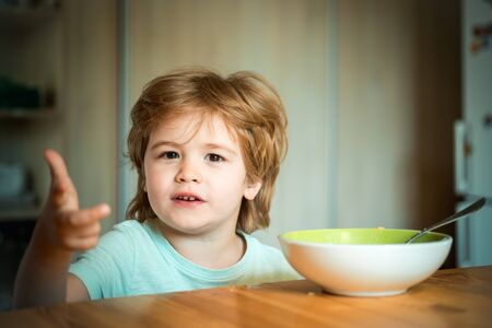 Baby eating. Food and Drink for Child. Little baby are eating. Good morning in Happy family. Childcare. Summer ration.の写真素材