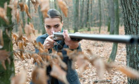 military fashion. gun barrel. achievements of goals. girl with rifle. chase hunting. Gun shop....