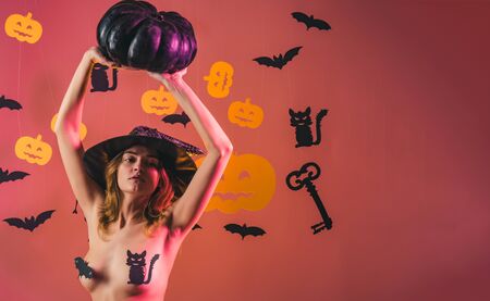 Halloween poster with pumpkins. Sexy Horror background. Womens clothing store celebrates Halloween. Happy Halloween Sexy Witchs with Big sexy ass. Erotic ladies Halloween concept.の写真素材