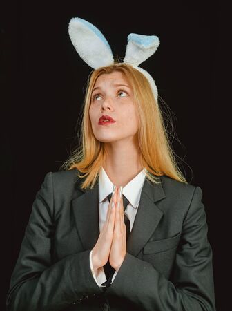 Sweet lovely attractive adorable charming cheerful positive girl in bunny ears celebrating Easter. Happy easter. Sexy woman wearing a black Easter Bunny.の写真素材