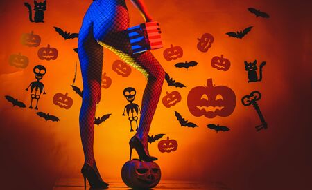 Autumn time for Fashion sale. Sexy Horror background. Womens clothing store celebrates Halloween. Pumpkin with sexy ass. Happy Halloween Sexy Witchs with Big sexy ass.の写真素材