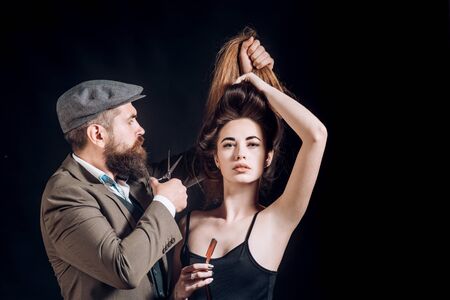 Hair Studios. Beauty woman getting haircut by hairdresser at barbershop hairstudios.