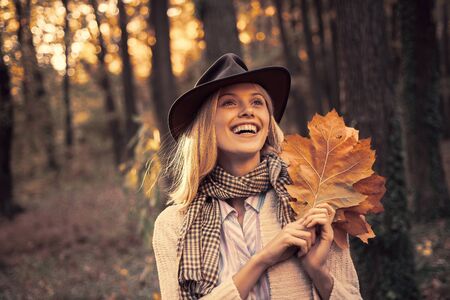 Autumn woman. Carefree young woman in trendy vintage pullover or sweater. Surprise autumn woman....