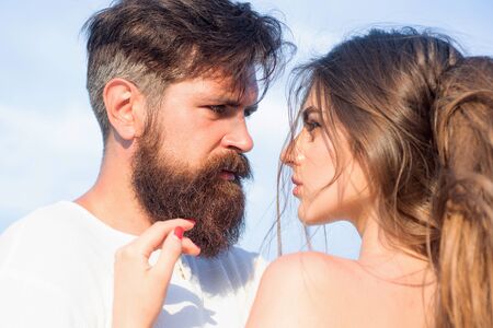Passionate man gently kissing beautiful woman with desire. Kiss each other teasing enjoying tenderness and intimacy. Loving man caressing hugging kissing woman.の写真素材