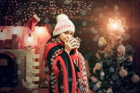 Happy little girl dressed in winter clothing think about Santa near Christmas tree. Winter kids. Kids Christmas. Christmas story concept. Christmas kids.の写真素材