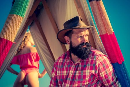 Play tent. Camping in improvised wooden house in nature. Cozy play tent for man on nature over sky background - isolated. Eco Resort Activities.の写真素材