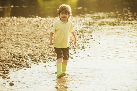 Kids lifestyle concept. Cute child having fun on River.