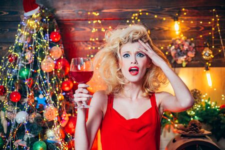 Christmas and new year holidays. Nervous, thrilled and scared emotions. Surprised Christmas couple. Excited and happy.の写真素材