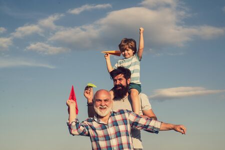 Generation of people and stages of growing up. Child pilot aviator with paper airplane dreams of...