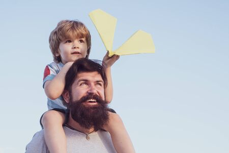 Child happy. Fathers day - father and son are hugging and having fun together.の写真素材