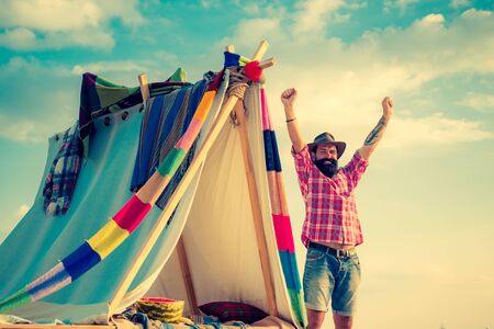 Camping tent on sunny day. Summer camp. Summer camp and nature tourism. Love makes a cottage a castle. You cant buy love. Summer camping on nature.の写真素材