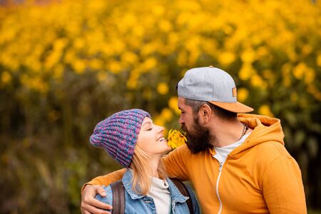 Autumn outdoor portrait of beautiful happy girl and bearded man walking in park or forest. Outdoor autumn portrait Gorgeous models with sunny day light.の写真素材