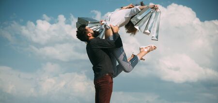 Incredible time for purchase. Happy couple in love enjoy doing their shopping and purchase. Bearded...