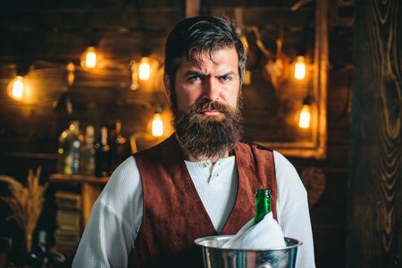 Bearded bartender or waiter in work uniform. Long bearded waiter or servant. Brutal bearded servant....