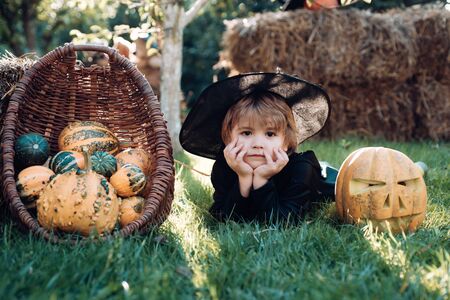 Portrait of Halloween child boy on nature background. Little boy enjoy life and nature. Funny boy.の写真素材