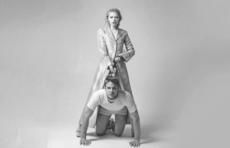 Dominantning in the foreplay sexual game. Woman and man playing domination games. Love relations and...
