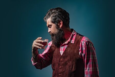 Sommelier tastes expensive alcohol drink. Tasting and degustation concept.