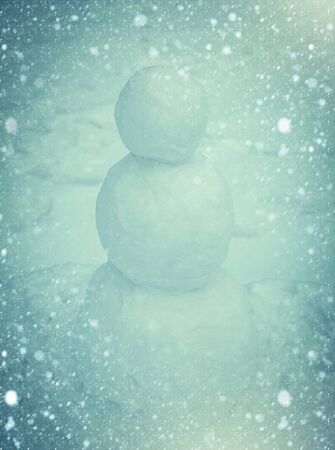 Snowman outdoor. Winter Art Greeting Card. Snowman standing in winter Christmas landscapeの写真素材