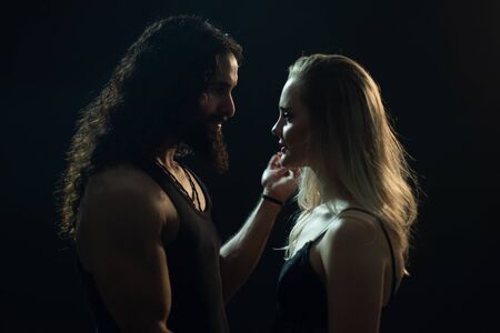 Sensual elegant couple in the tender passion. Handsome man touching womans face. Romantic couple...