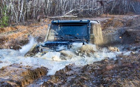 Track on mud. Off road car. Safari. Best off-road vehicles. Jeep crushed into a paddle and picked up...