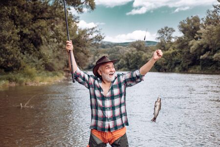 Elegant bearded man fishing. Catching and fishing. Hunting. Perfect weekend. Just do that only....