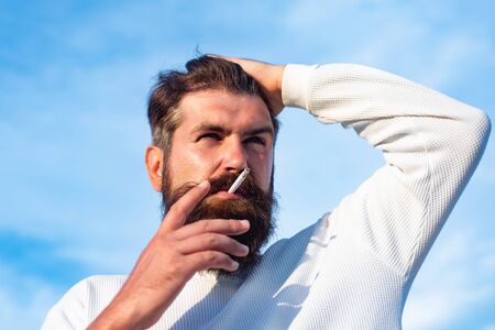 Mature blonde bearded guy with trendy hairdo in casual shirt. Professional model and professional...