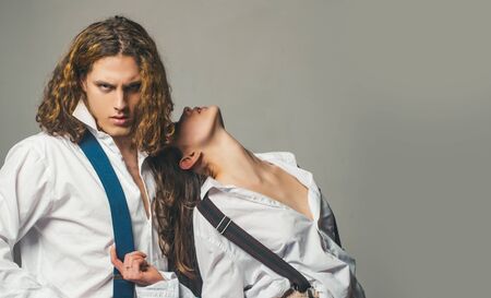 Fashion photo of sexy elegant couple in the tender passion. Trust. Studio portrait. Loving everything about her. Pose for family portrait. Young. Love concept. Copy space. Sensuality.の写真素材